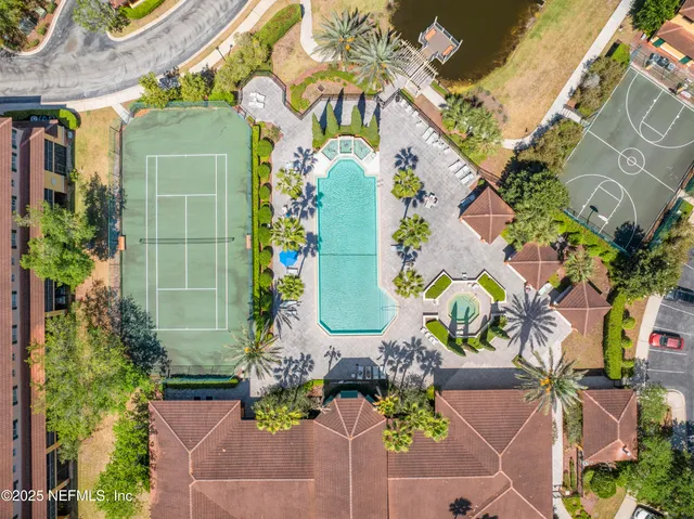 a swimming pool with outdoor seating and yard