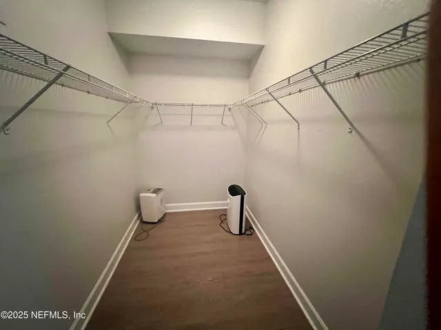 a view of a room with racks on the wall