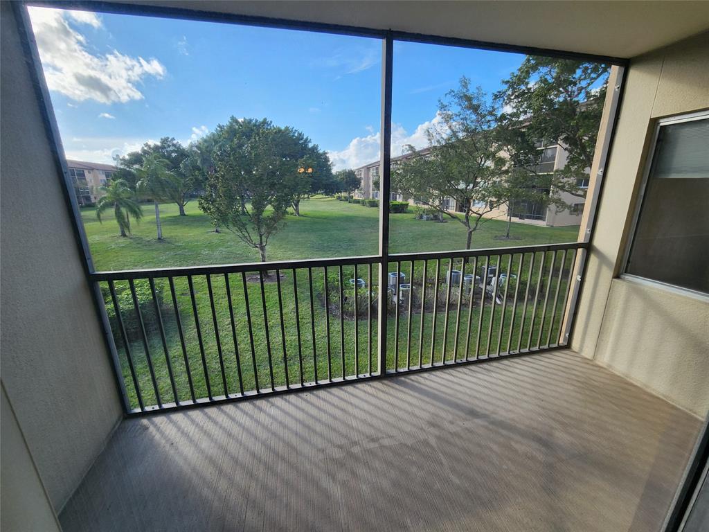 1650 Southwest 124th Terrace, Unit 209D Pembroke Pines, FL 33027 - Photo 7 of 19 a view of a porch