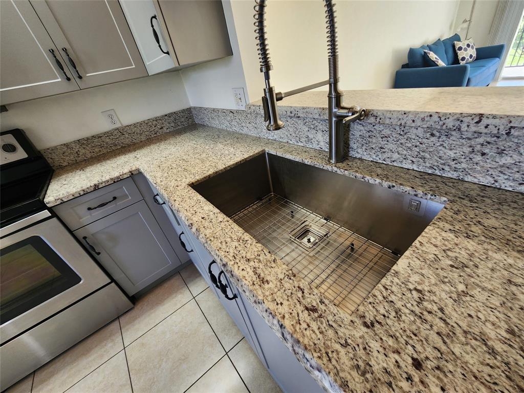 1650 Southwest 124th Terrace, Unit 209D Pembroke Pines, FL 33027 - Photo 10 of 19 a view of a kitchen counter space