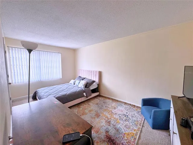 a bed room with a bed furniture and a window