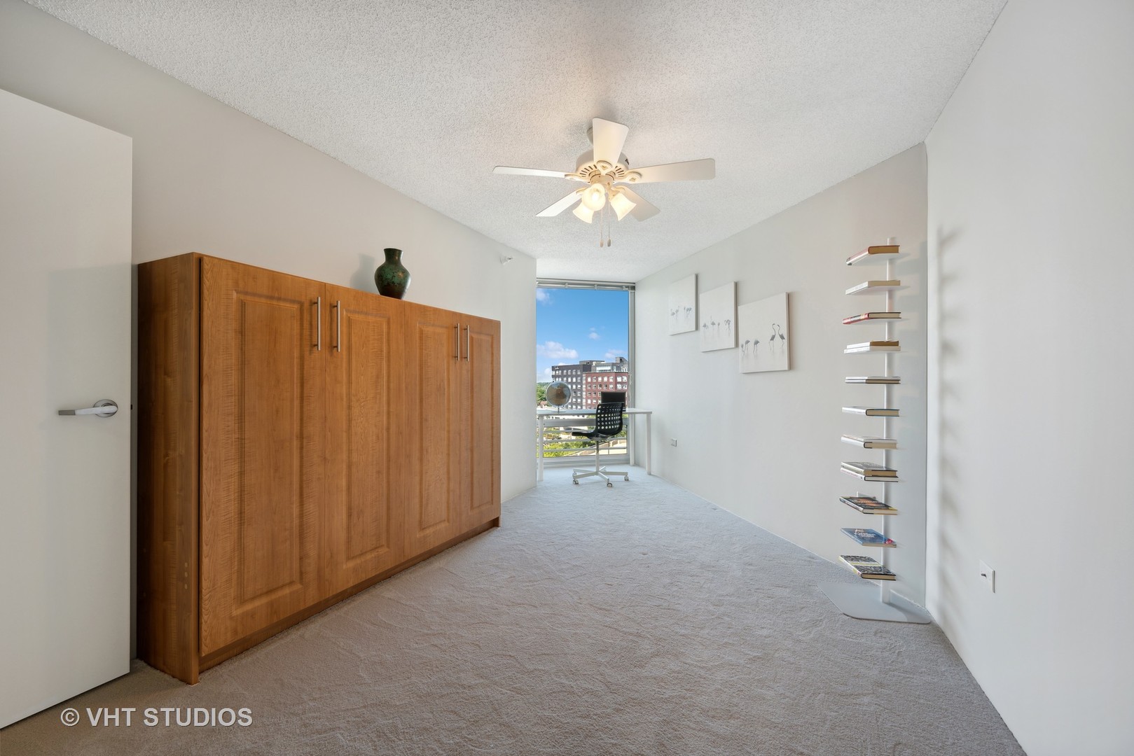 1720 Maple Avenue, Unit 1040 Evanston, IL 60201 - Photo 16 of 35 a view of a kitchen with cabinet and a ceiling fan