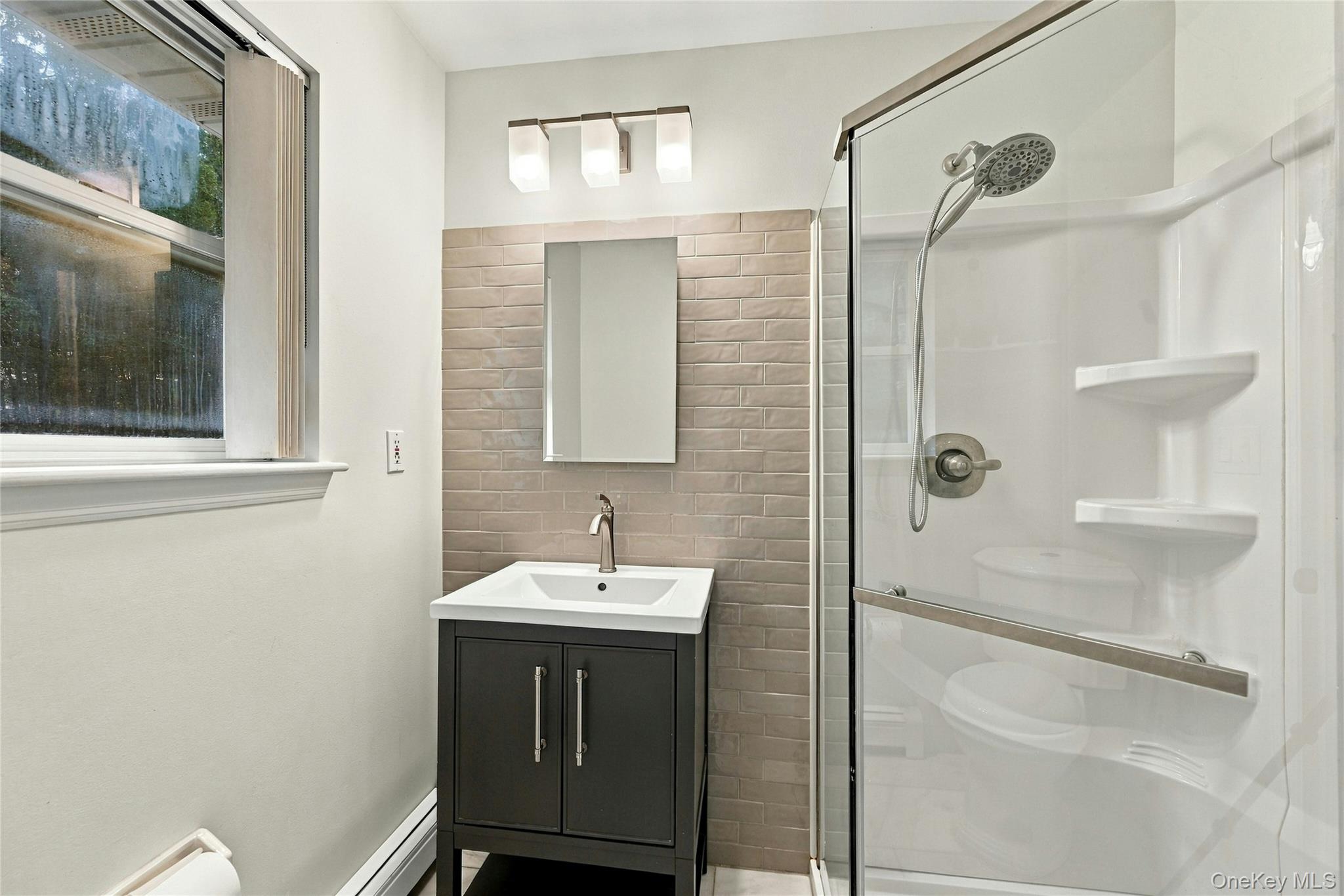 16 Georgann Road Manorville, NY 11949 - Photo 17 of 32 Primary bathroom recently upgraded.