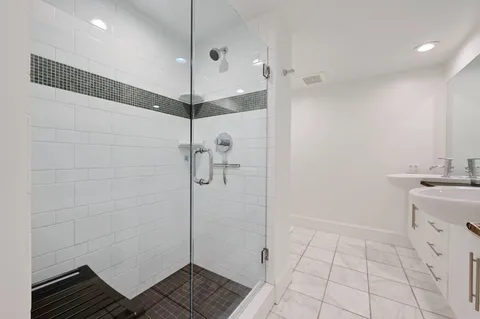 a bathroom with a sink and a shower