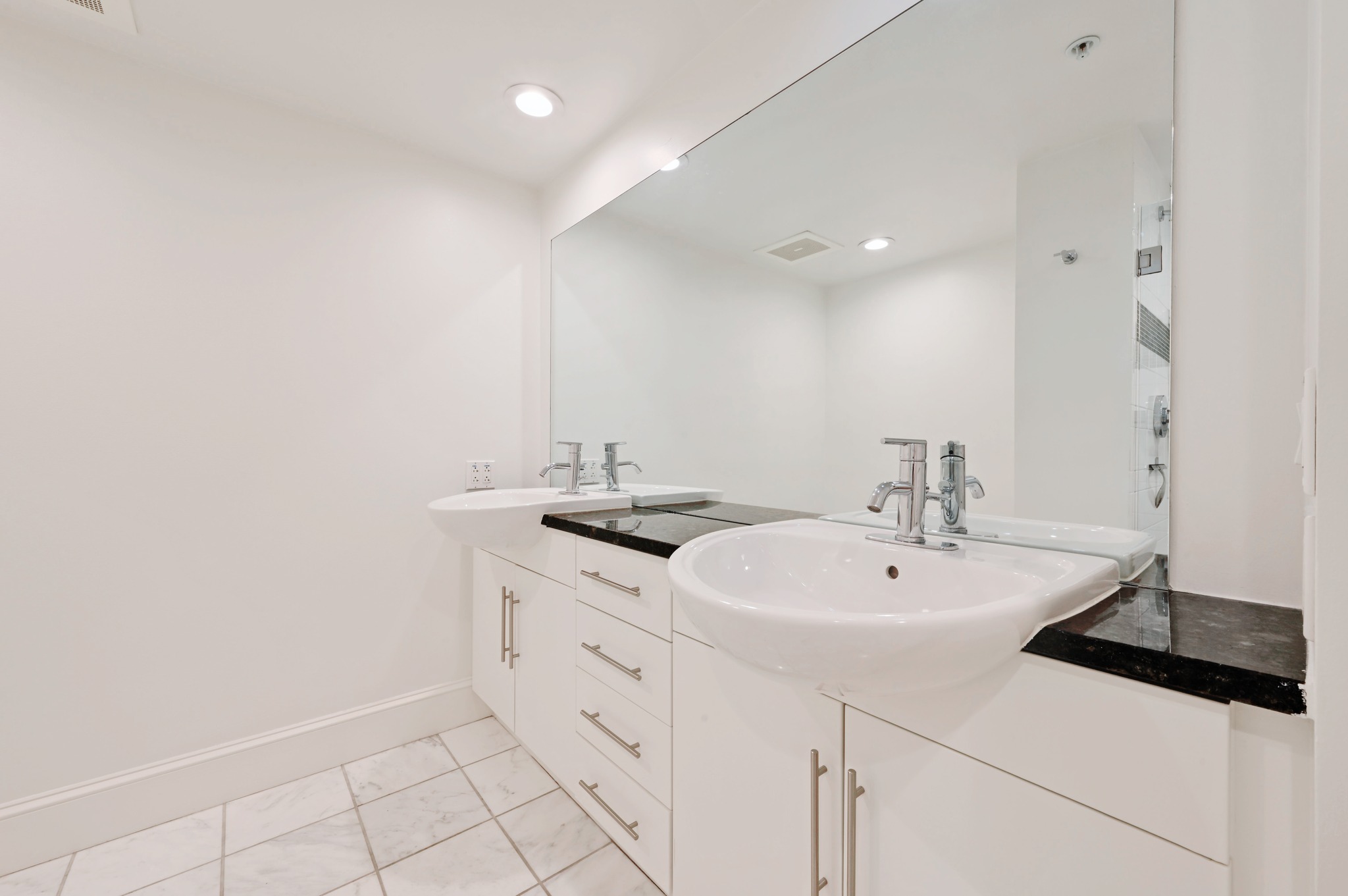 300 Bowie Street, Unit 2902 Austin, TX 78703 - Photo 14 of 40 a bathroom with a sink and a mirror