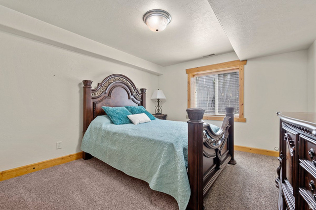 288 South Hillside Drive Elk Ridge, UT 84651 - Photo 18 of 27 Large bedroom with big window offering natural light