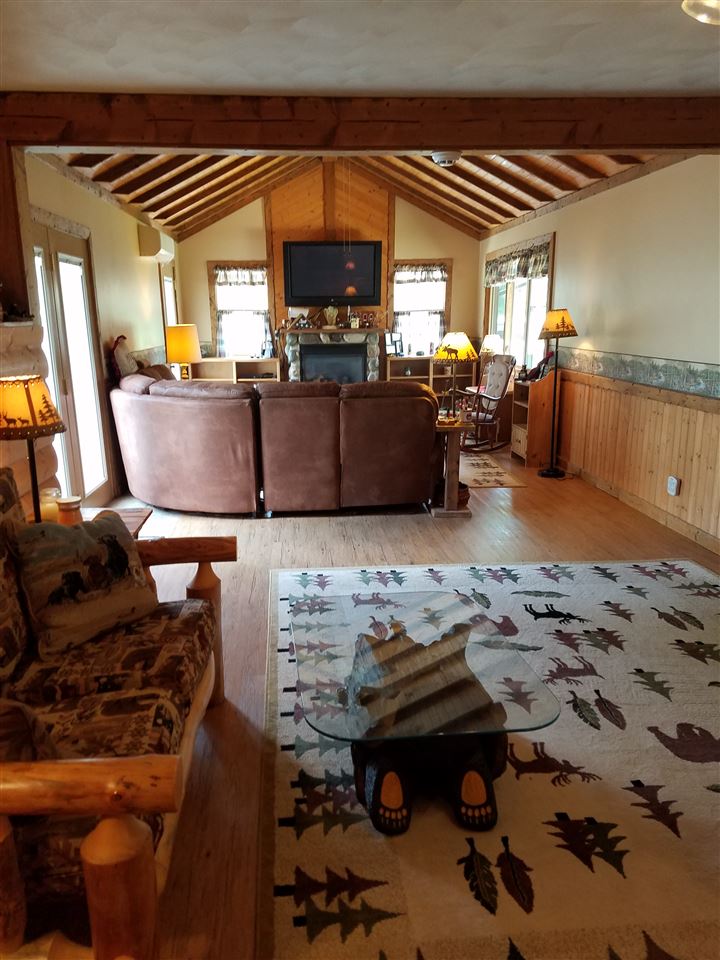 1101 East Spring Creek Road Oregon, IL 61061 - Photo 12 of 22 a bed room with furniture and a flat screen tv