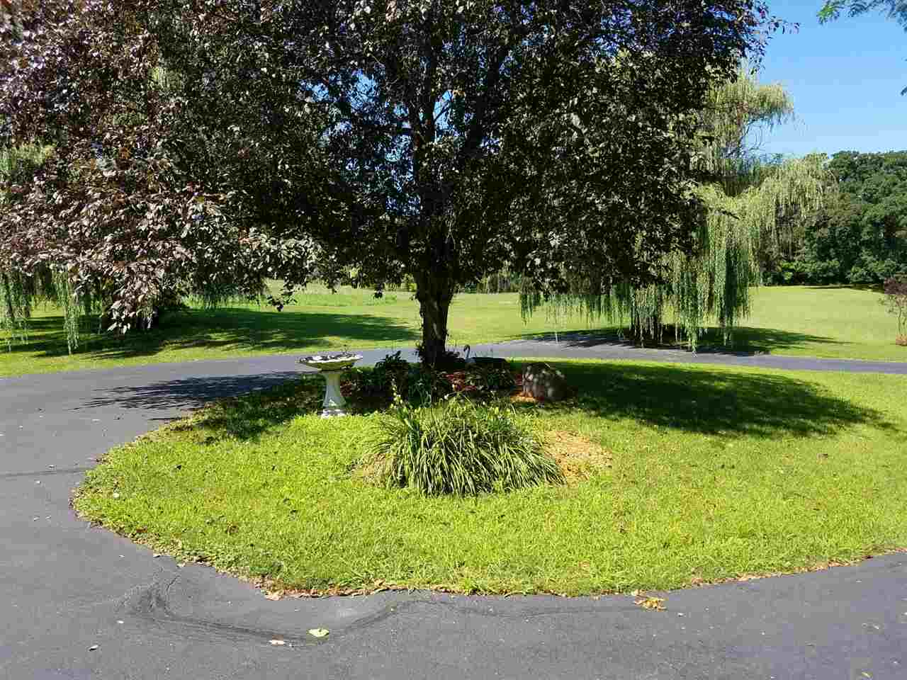 1101 East Spring Creek Road Oregon, IL 61061 - Photo 19 of 22 a view of a garden with a bench