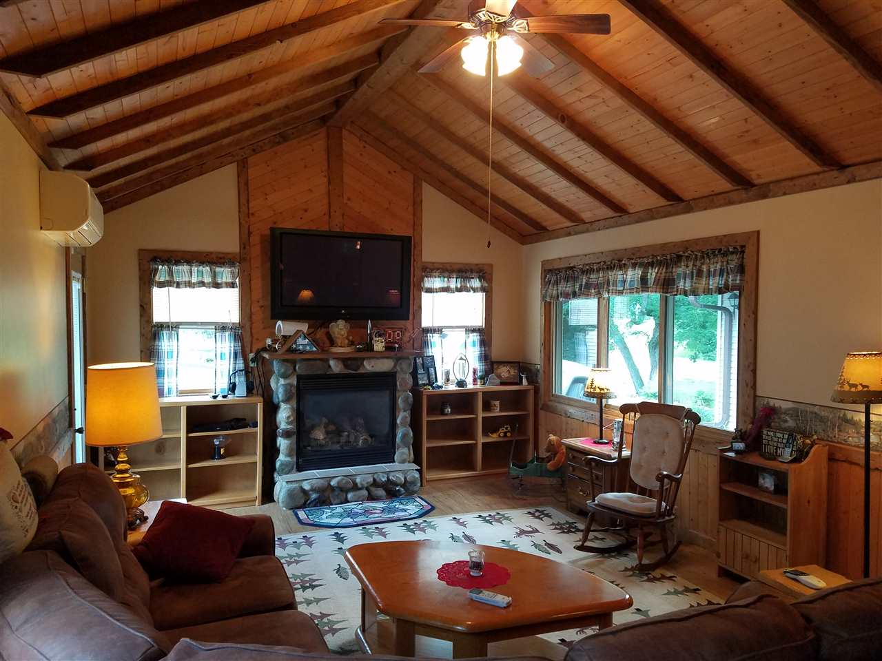 1101 East Spring Creek Road Oregon, IL 61061 - Photo 3 of 22 a living room with furniture and a fireplace