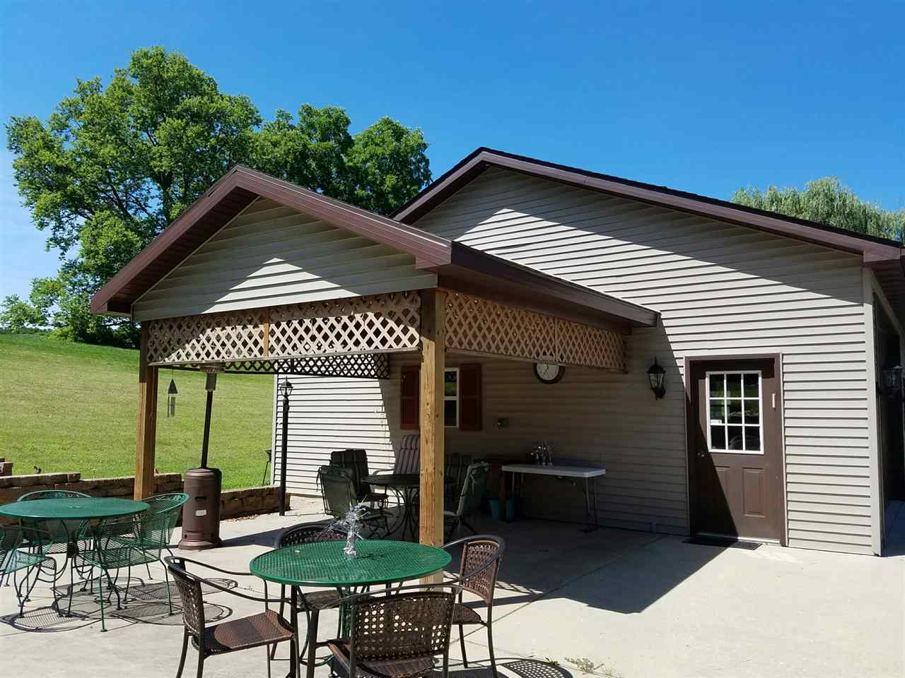 1101 East Spring Creek Road Oregon, IL 61061 - Photo 4 of 22 a front view of a house with garden