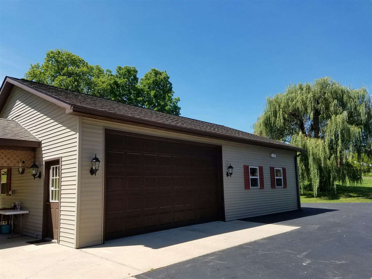 1101 East Spring Creek Road Oregon, IL 61061 - Photo 5 of 22 a front view of a house with a yard
