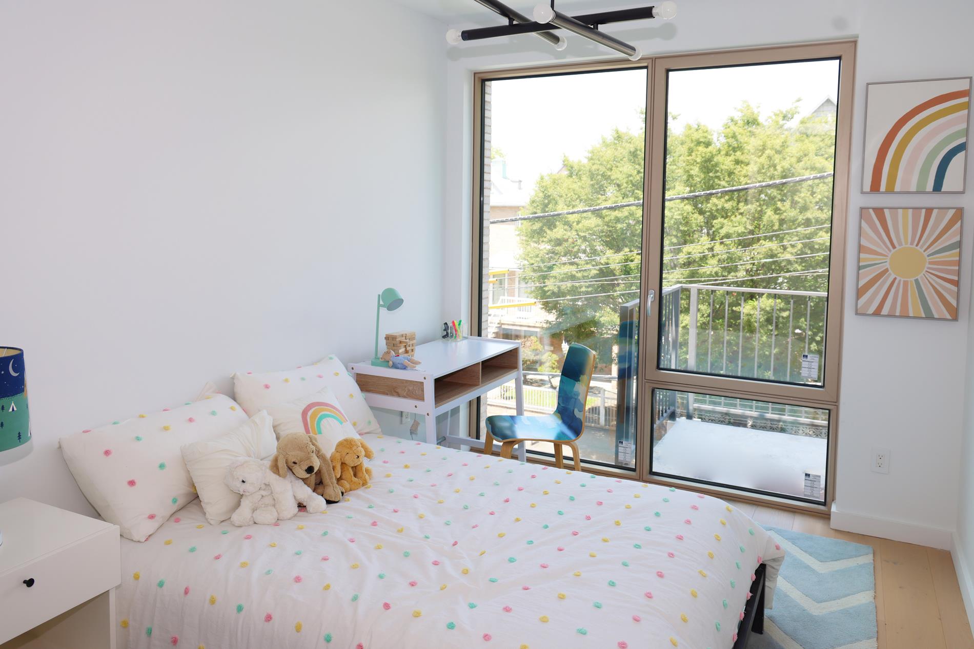 1548 72nd Street, Unit 302 Brooklyn, NY 11228 - Photo 8 of 12 a bedroom with a bed and a window