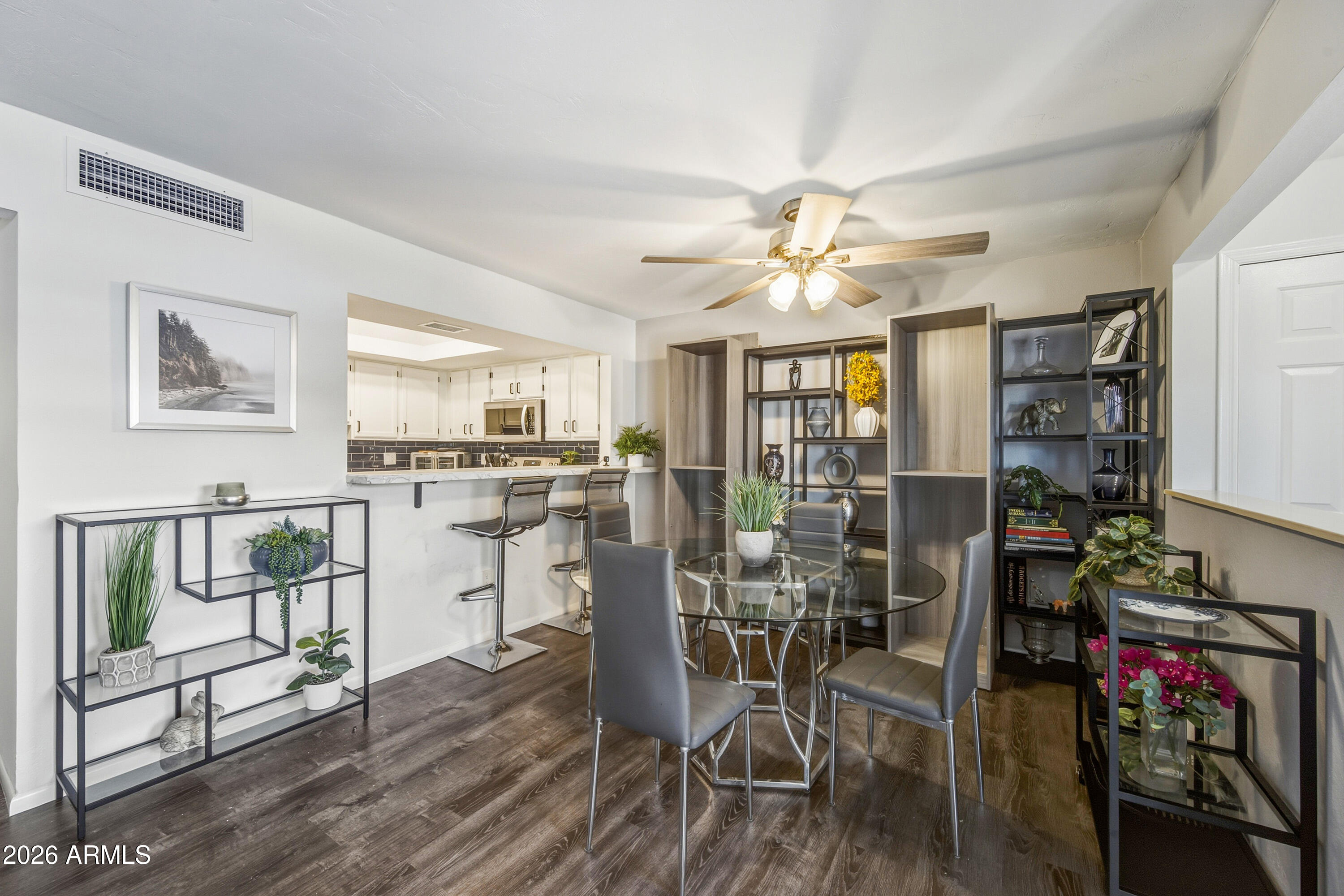 1645 West Baseline Road, Unit 2002 Mesa, AZ 85202 - Photo 3 of 21 a view of a dining room with furniture window and wooden floor