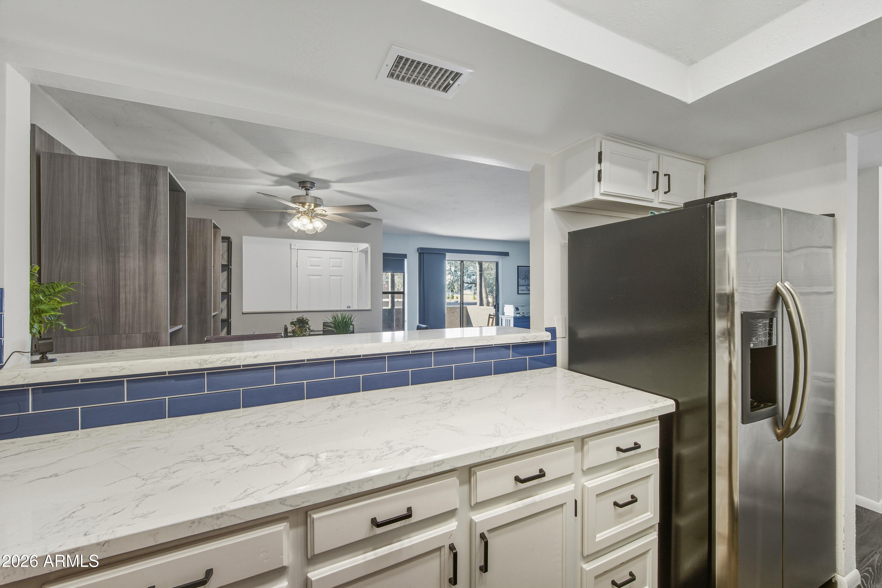 1645 West Baseline Road, Unit 2002 Mesa, AZ 85202 - Photo 8 of 21 a view of a kitchen with a refrigerator and a sink
