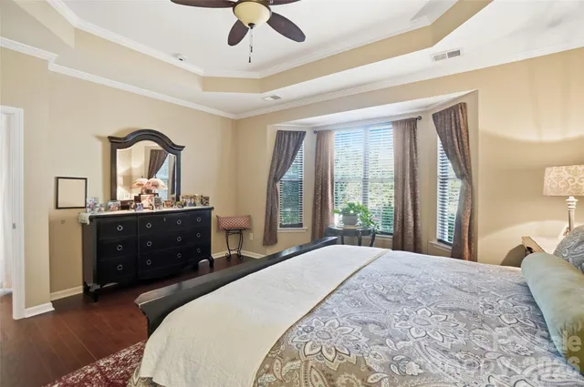 a bedroom with a bed and a table