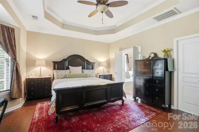 a bed room with a bed and a television