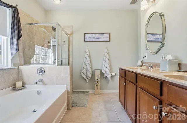 a bathroom with a bathtub and shower
