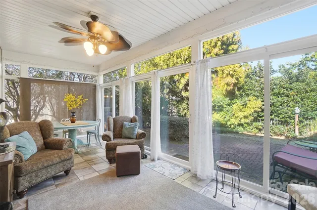 a bedroom with furniture and a window