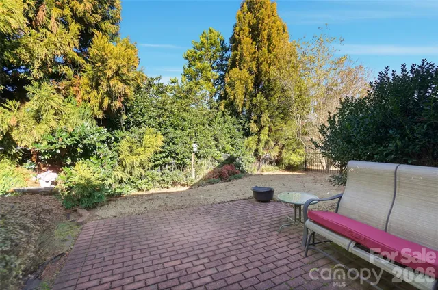 a view of a house with a tree