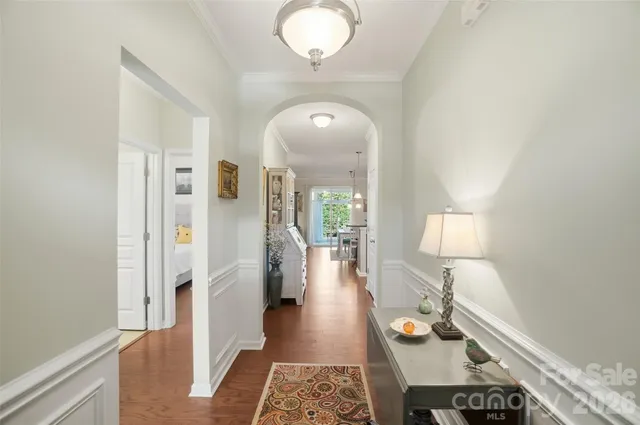 a living room with furniture and a mirror