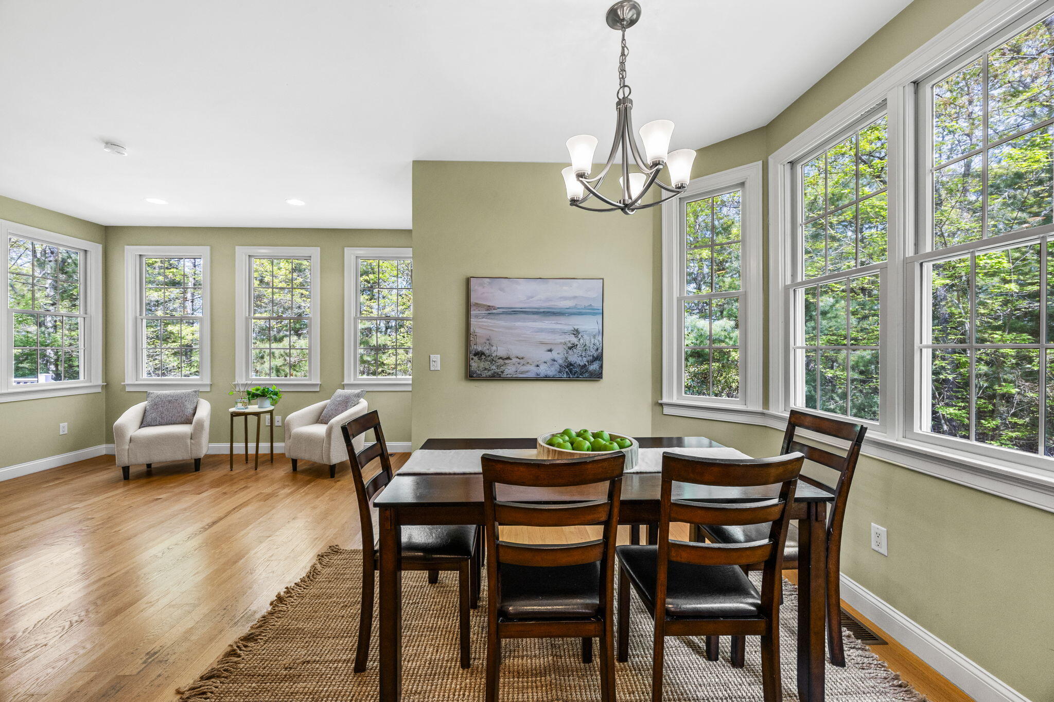 17 Payamps Road Mashpee, MA 02649 - Photo 32 of 72 a dining room with furniture a chandelier and wooden floor