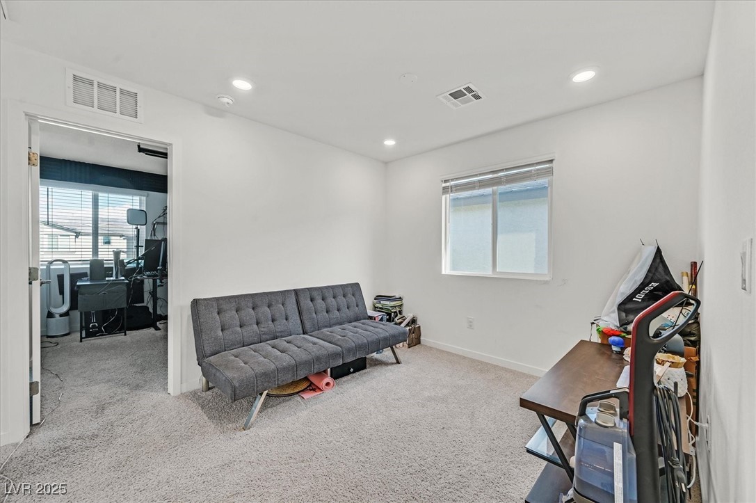 2885 Timber Country Road North Las Vegas, NV 89086 - Photo 13 of 26 Living area featuring carpet flooring, visible vents, and baseboards