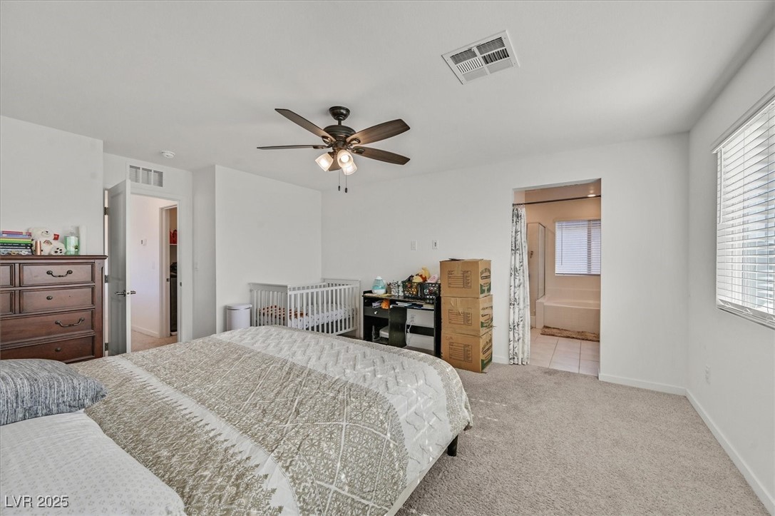 2885 Timber Country Road North Las Vegas, NV 89086 - Photo 17 of 26 Bedroom with visible vents, ceiling fan, carpet flooring, and baseboards