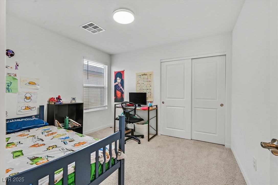 2885 Timber Country Road North Las Vegas, NV 89086 - Photo 20 of 26 Carpeted bedroom with visible vents, a closet, and baseboards