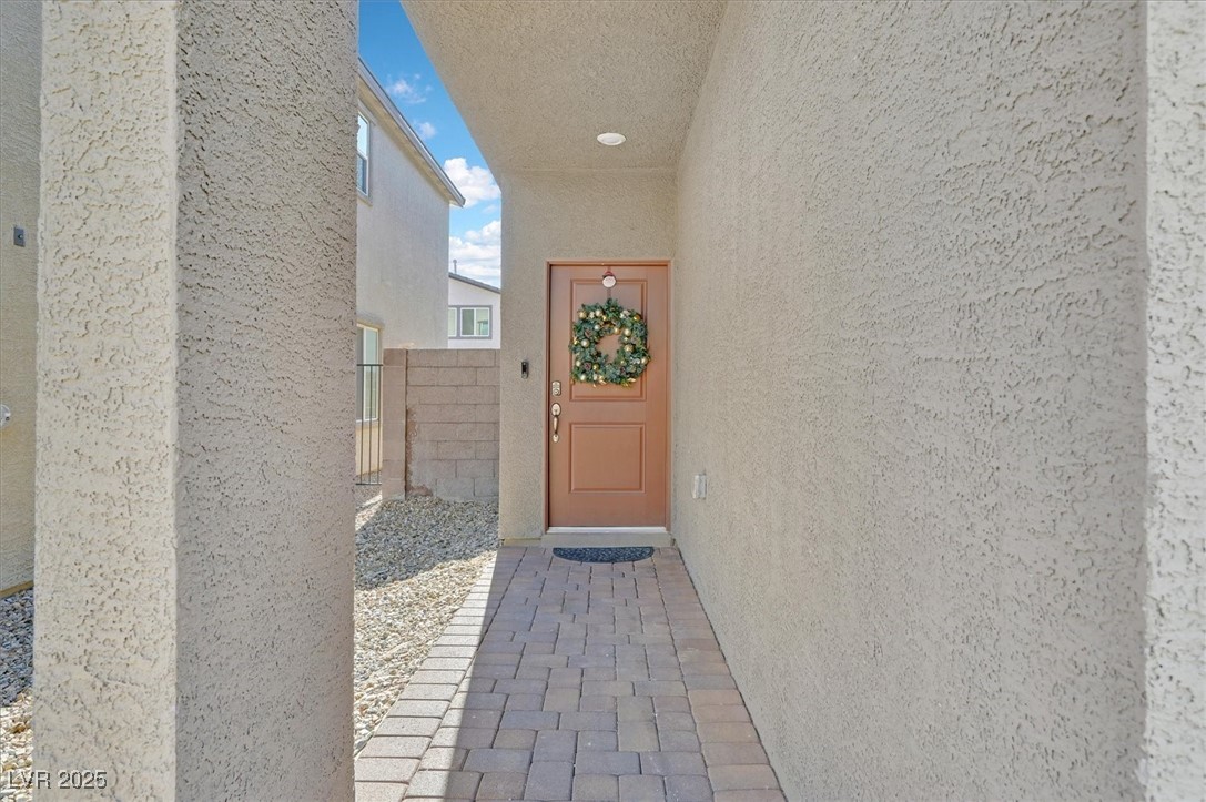 2885 Timber Country Road North Las Vegas, NV 89086 - Photo 2 of 26 Entrance to property with stucco siding and fence