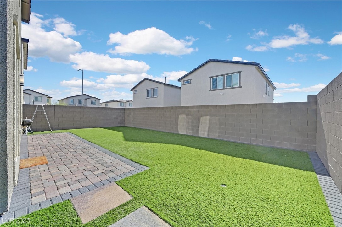 2885 Timber Country Road North Las Vegas, NV 89086 - Photo 24 of 26 View of yard with a patio area and a fenced backyard