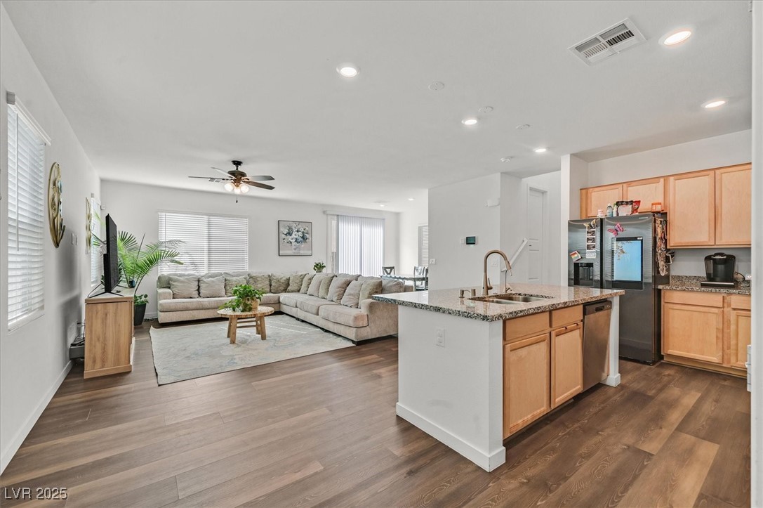 2885 Timber Country Road North Las Vegas, NV 89086 - Photo 3 of 26 Kitchen featuring light brown cabinetry, appliances with stainless steel finishes, ceiling fan, a sink, and visible vents