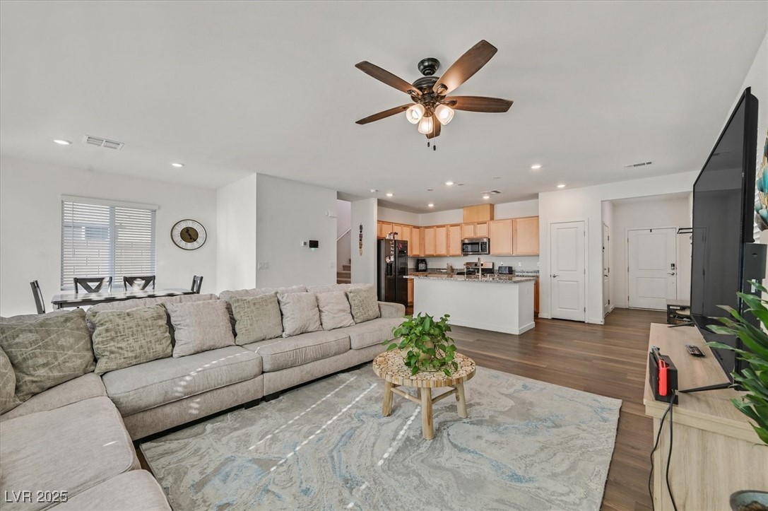 2885 Timber Country Road North Las Vegas, NV 89086 - Photo 5 of 26 Living area featuring visible vents, ceiling fan, dark wood-type flooring, and recessed lighting