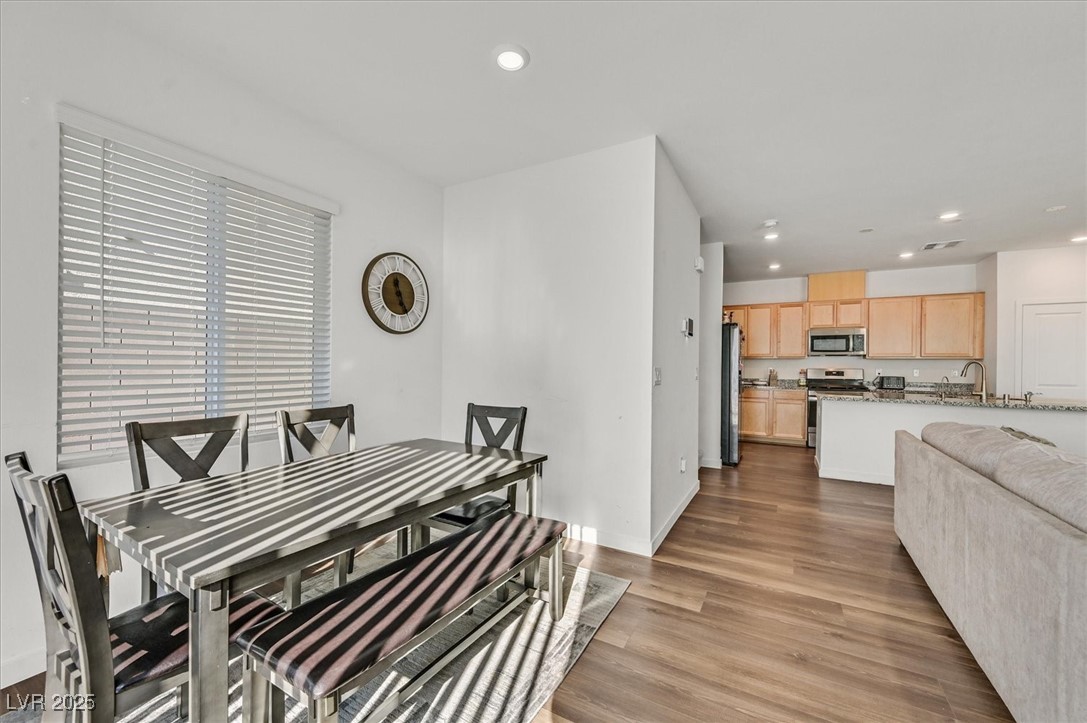2885 Timber Country Road North Las Vegas, NV 89086 - Photo 7 of 26 Dining room with recessed lighting, wood finished floors, and baseboards