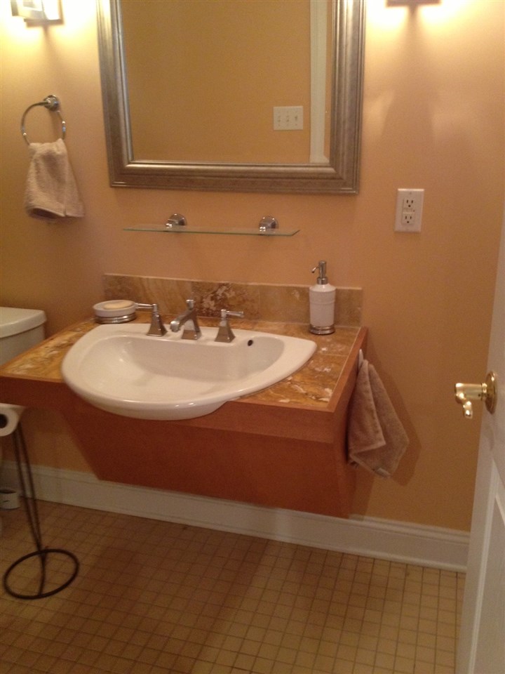 2508 Summit Ridge Trail Charlottesville, VA 22911 - Photo 29 of 32 a bathroom with a sink and a mirror