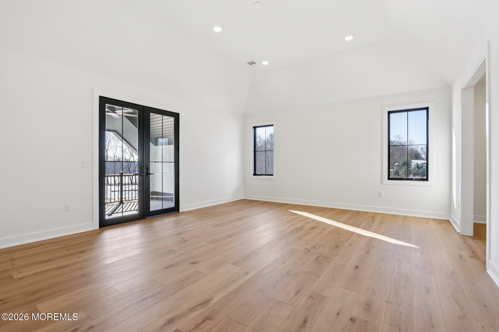 4 Fortune Court Freehold, NJ 07728 - Photo 83 of 104 an empty room with wooden floor and windows