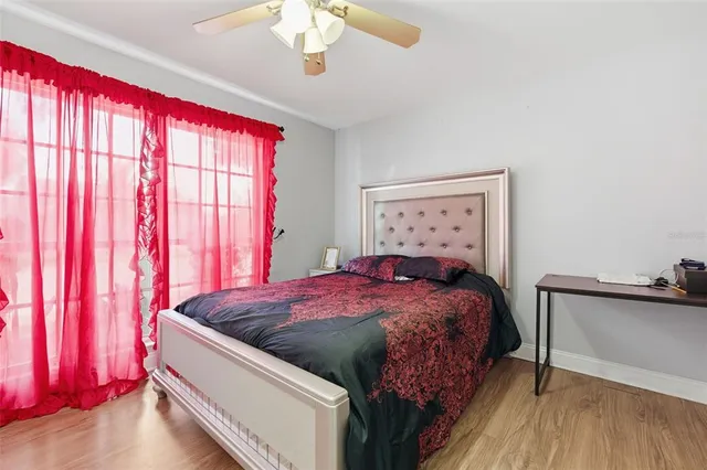 a bedroom with a bed and a window