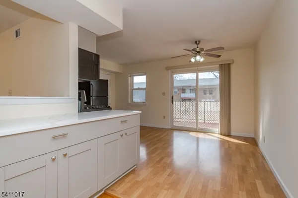 a view of a kitchen with a sink and a window