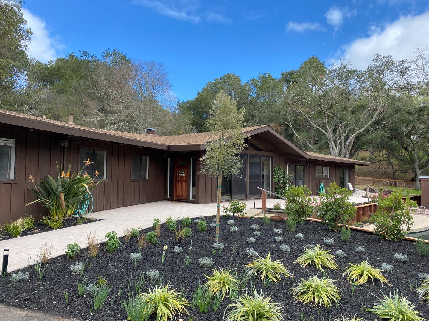 121 Degas Road Portola Valley, CA 94028 - Photo 1 of 1 a front view of a house with a yard