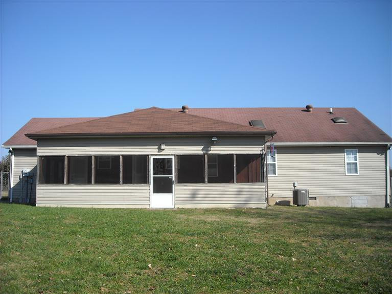 back view of home. Screened in back porc