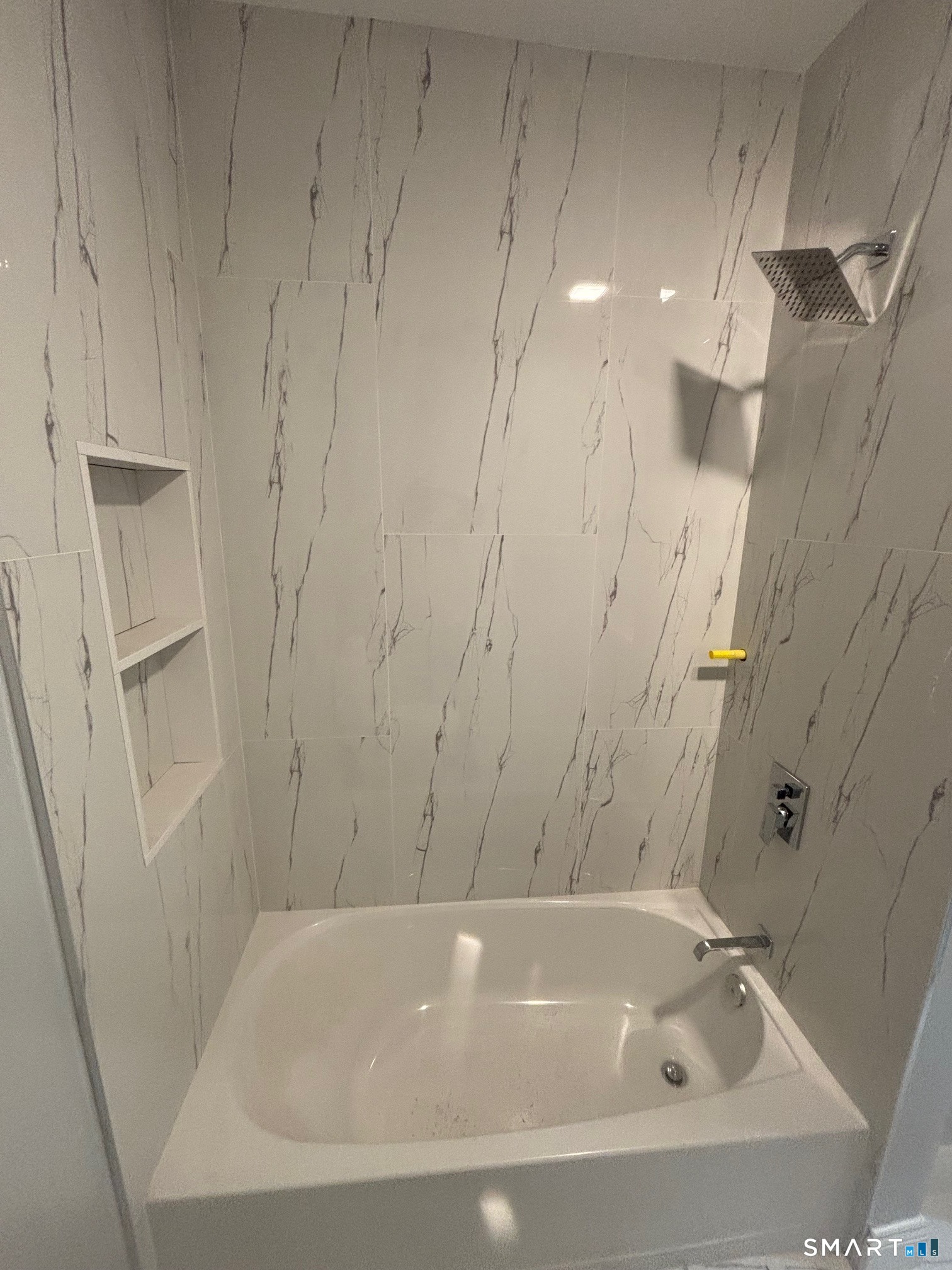 9 Clark Street Ansonia, CT 06401 - Photo 8 of 9 a bathroom with a bathtub