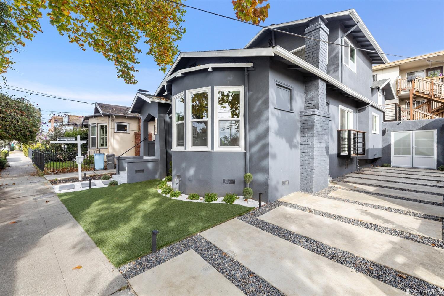 2935 Acton Street Berkeley, CA 94702 - Photo 2 of 63 a view of a white house with a small yard plants and a fountain