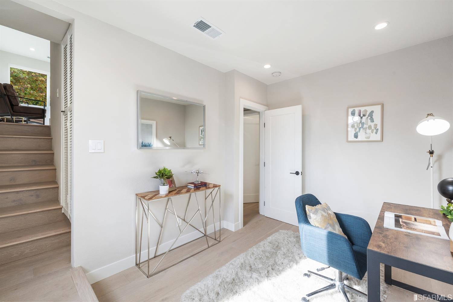 2935 Acton Street Berkeley, CA 94702 - Photo 25 of 63 a living room with furniture and a potted plant
