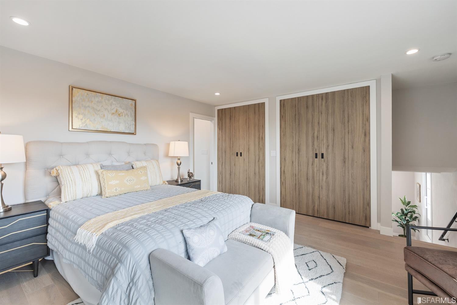 2935 Acton Street Berkeley, CA 94702 - Photo 27 of 63 a spacious bedroom with a bed and a couch