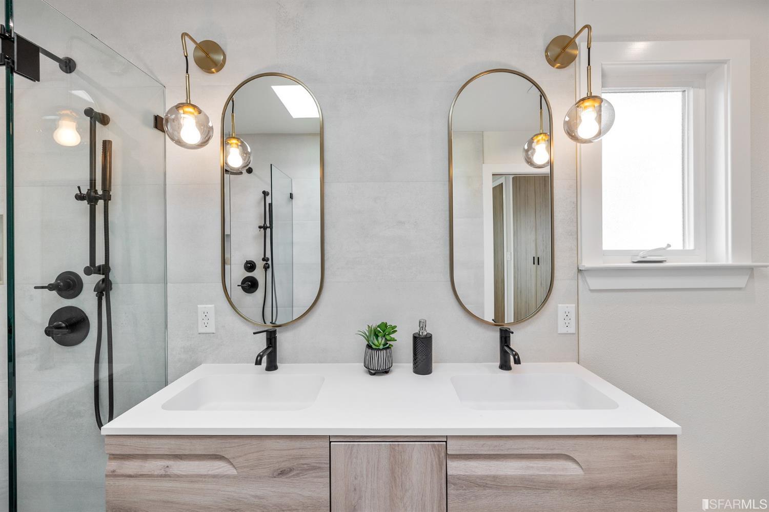 2935 Acton Street Berkeley, CA 94702 - Photo 33 of 63 a bathroom with mirror a sink and glass door with a mirror