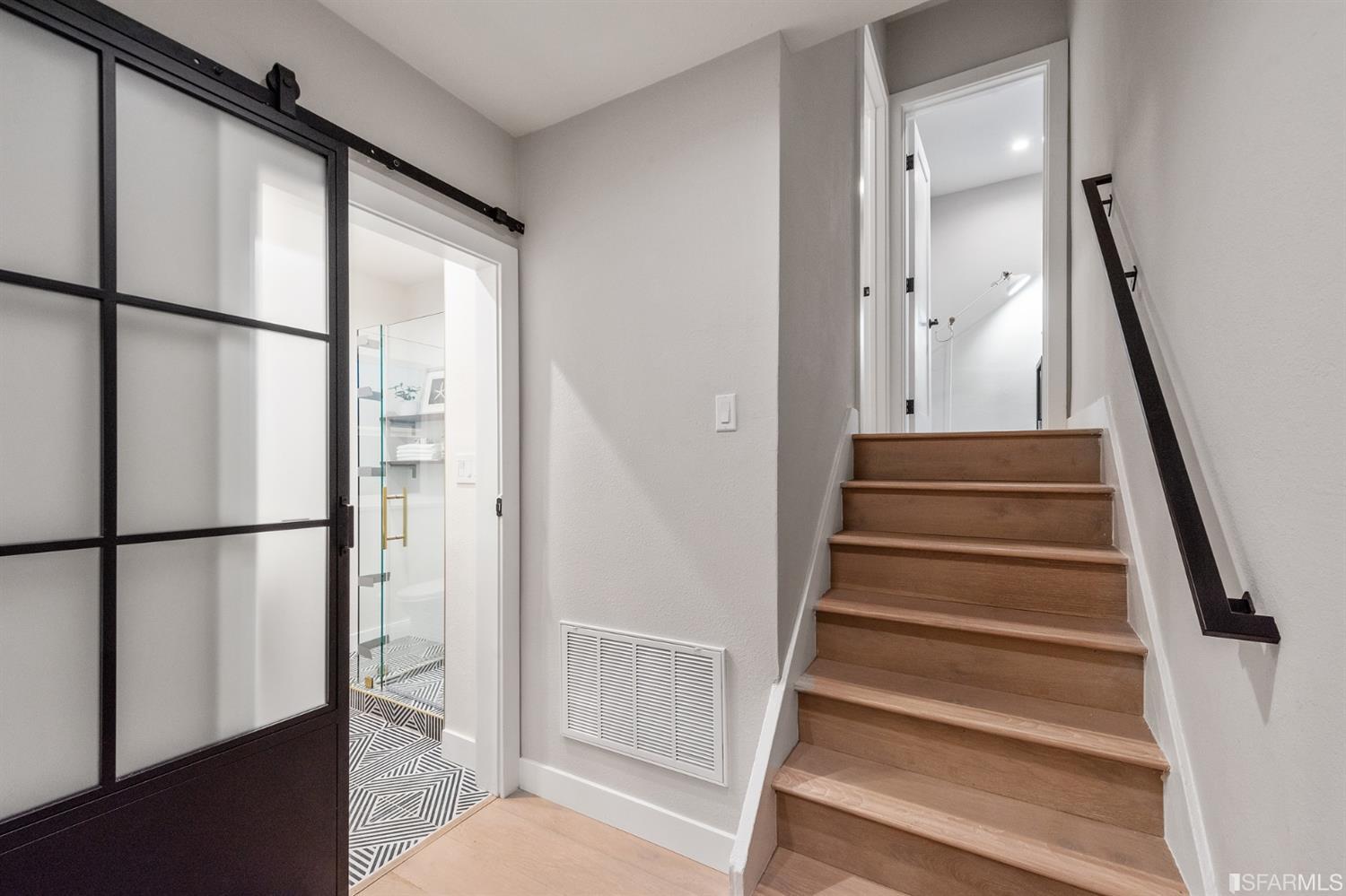 2935 Acton Street Berkeley, CA 94702 - Photo 59 of 63 a view of staircase with wooden floor and white walls