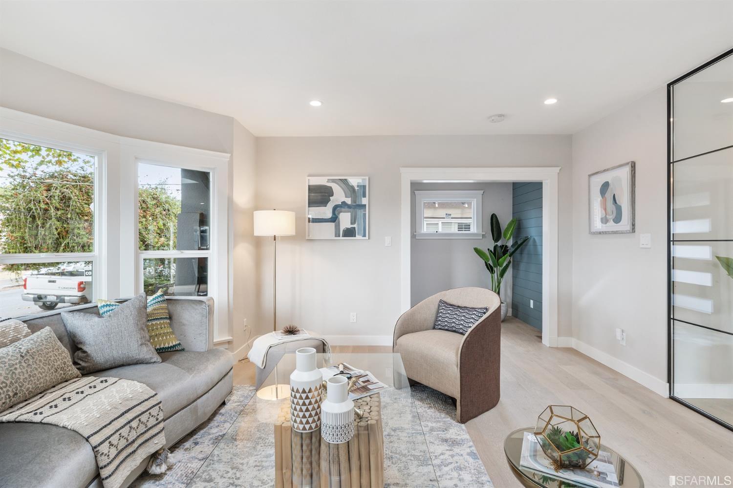 2935 Acton Street Berkeley, CA 94702 - Photo 7 of 63 a living room with furniture and a large window