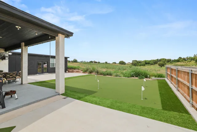a view of a balcony with lake view and a floor to ceiling window