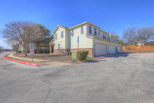 a view of a street with a building in the background