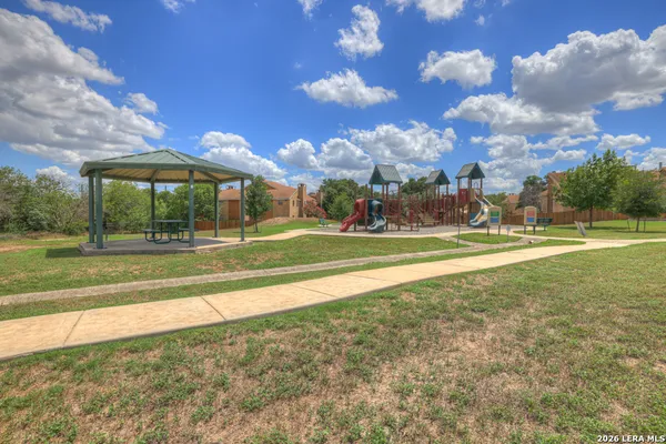 a view of a park with swings