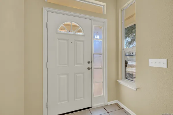 a view of a hallway with front door
